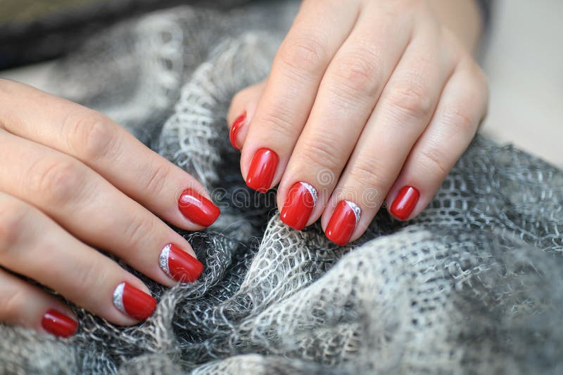 Hands with Long Artificial Manicured Nails Colored with Red Nail Polish ...