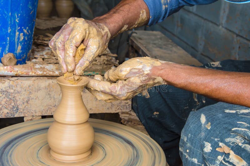 Hands of Making Clay Pot on the Pottery Wheel ,select Focus, Closeup