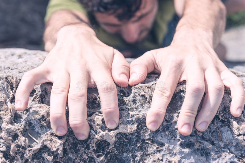 Hands of Man Climbing stock photo. Image of active, wall 57237830