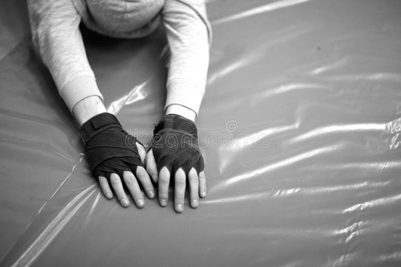 Hands of a Man in Fingerless Gloves Doing Streching Exercises Stock