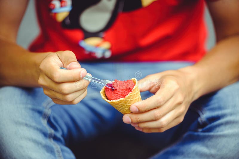 Hands of a man with ice cream