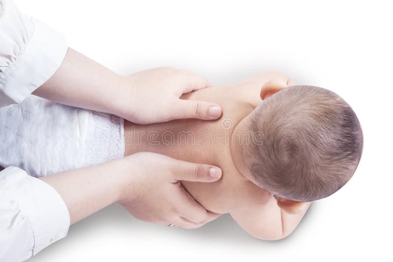 Hands massage the spine of baby stock photography Hands massage the spine of baby stock photography
