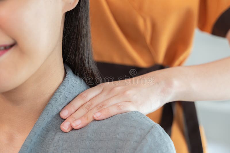 Masseur Hands Make Neck Massage For Beautiful Woman On Massage Table