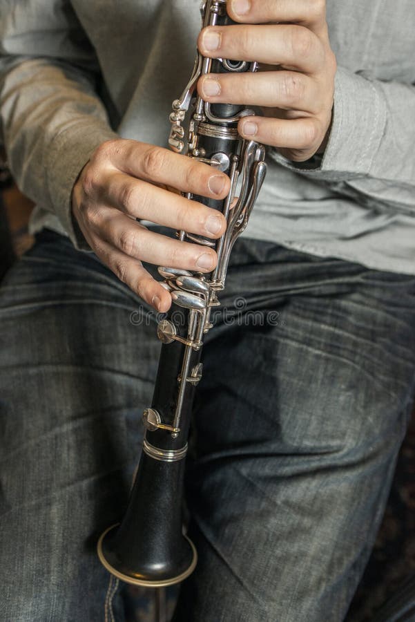 Hands of a Musician Preparing To Play the Stock Photo Image
