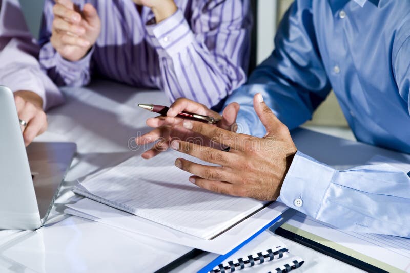 Hands of office workers working on laptop stock images