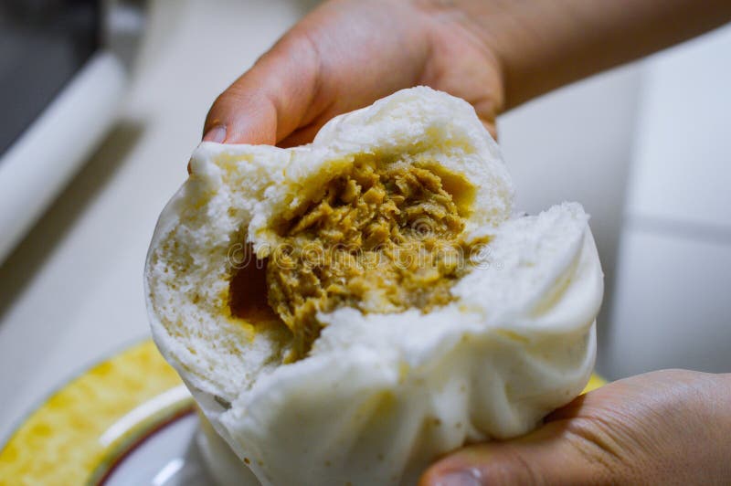 White Chinese Steamed Bun Showing Stuffered Meat Veggies Inside Stock