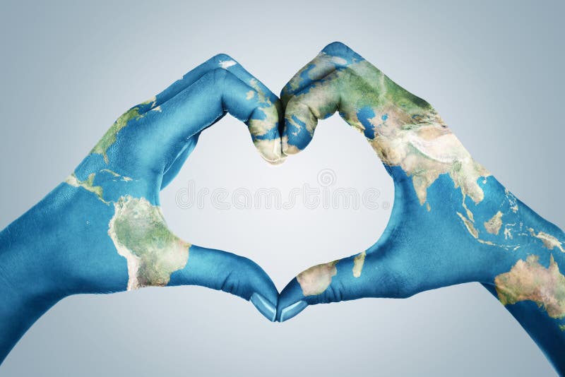 Hands, painted in the world map,  forming heart shape