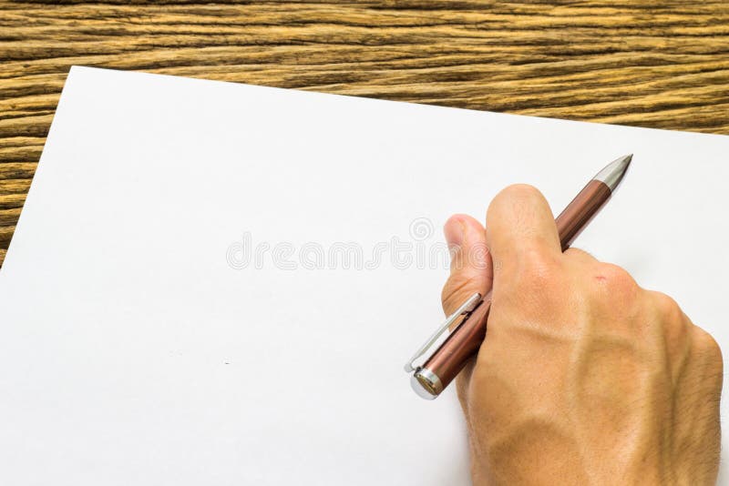 Hands with Pen Over Paper on Wooden Background Stock Photo - Image of ...