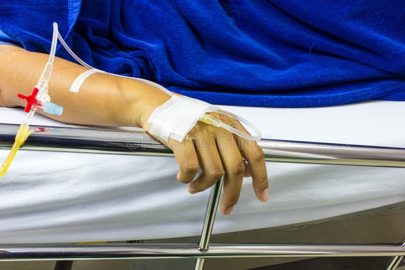 Hands of people a sick loved ones lying on a bed in the hospital. Hands of people a sick loved ones lying on a bed in the hospital stock photos Hands of people a sick loved ones lying on a bed in the hospital. Hands of people a sick loved ones lying on a bed in the hospital stock photos