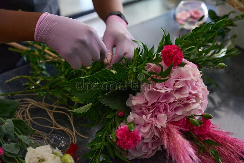 Hands in Pink Thick Gloves Wrap a Bouquet Stock Photo Image of worker