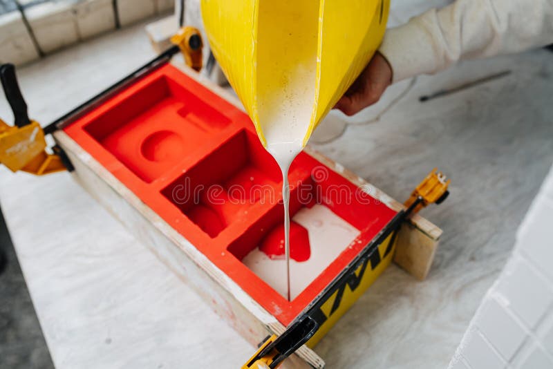 Pouring of plaster stock photo. Image of mixing, work 100434984