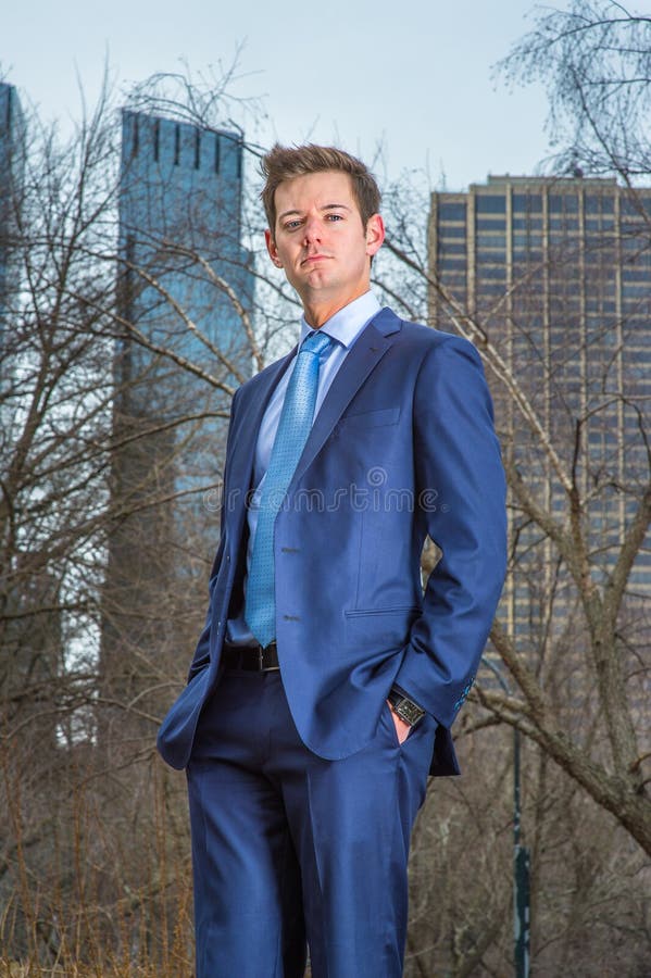 Young Man standing outdoors, looking forward stock images