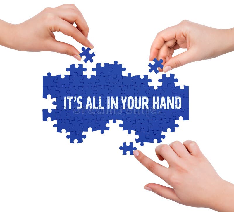 Hands with puzzle making ITâ€™S ALL IN YOUR HAND word royalty free stock images