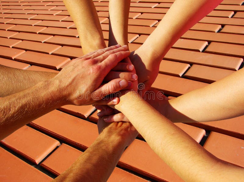 Hands on red brick