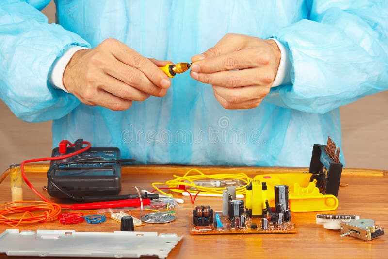 Hands Service Engineer of Electronic Equipment with Screwdriver Stock