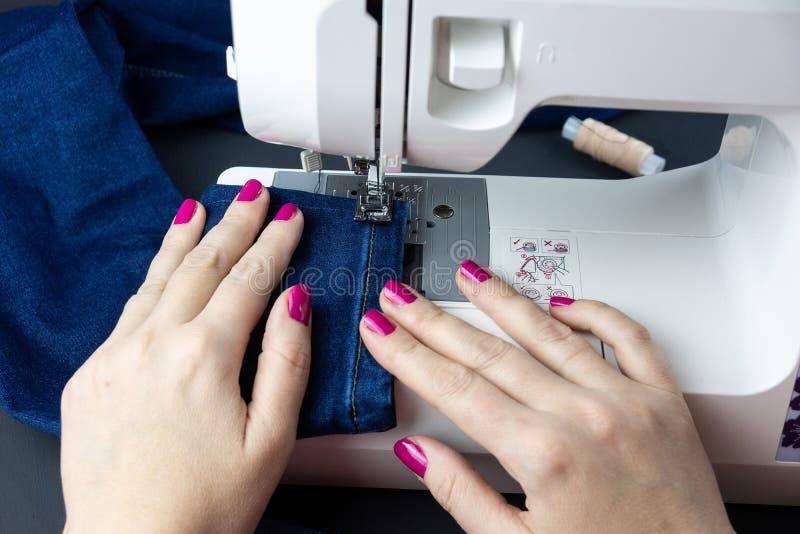 Hands on the Sewing Machine Stock Photo Image of close, fabric 165997106