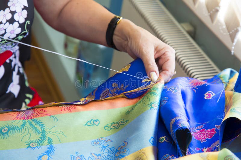 Hands Sewing with Needle and Thread Stock Photo Image of person