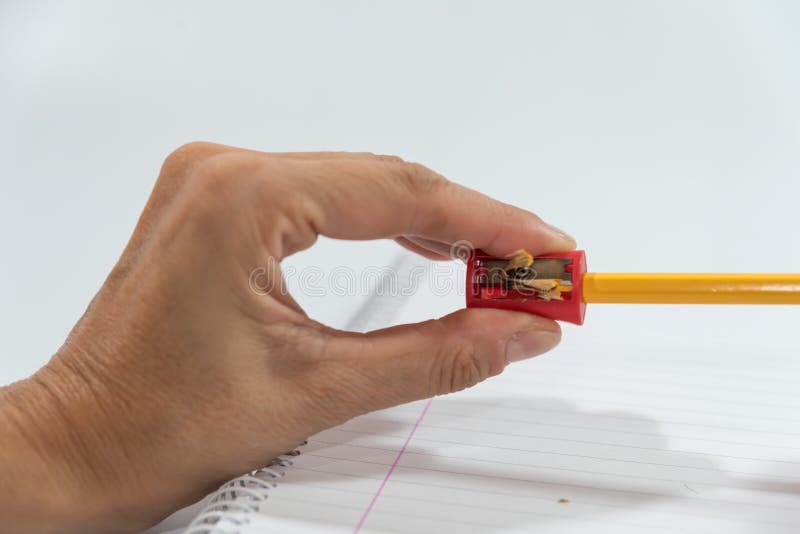 Hands Sharpening a Pencil with a Sharpener Stock Photo Image of