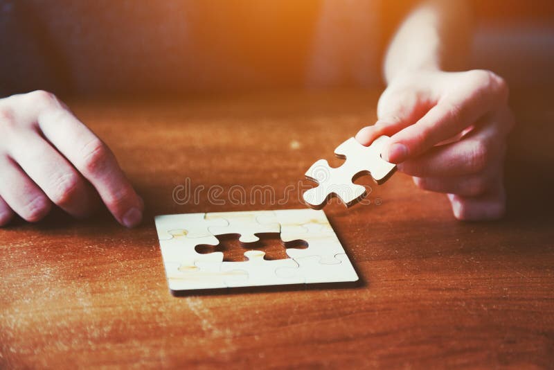 Hands Solving Jigsaw Puzzle Stock Photo Image of building, game 94768704