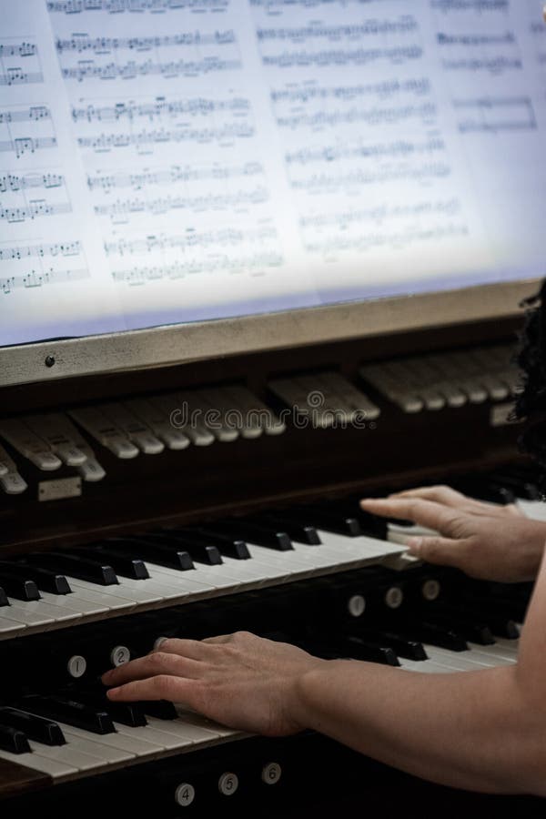 Hands of Someone playing Organ stock images