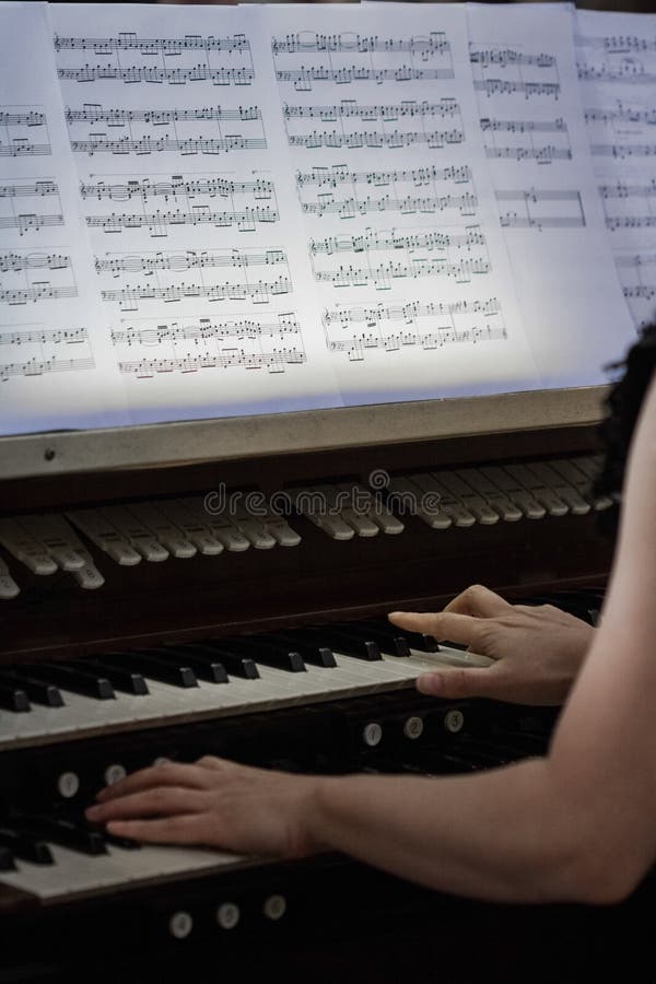 Hands of Someone playing Organ stock images
