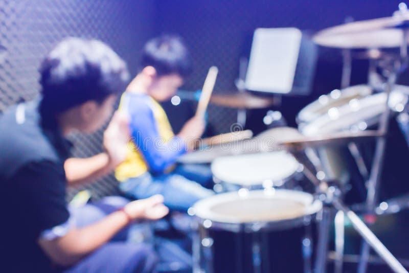 Hands of Teacher with Wooden Drumsticks Guiding Boy in Drum Learning Tutorial in Recording