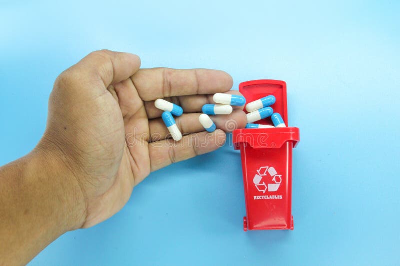 Hand Throwing Pills Away. Health Concept Stock Photo, Picture and