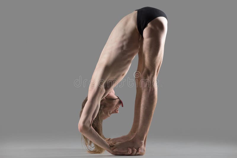 Hands to Feet Pose (Padahastasana) yoga posture royalty free stock images Hands to Feet Pose (Padahastasana) yoga posture royalty free stock images
