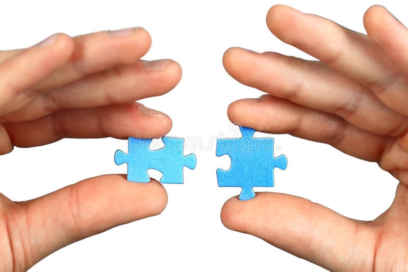 Hands with two puzzles royalty free stock photography Hands with two puzzles royalty free stock photography