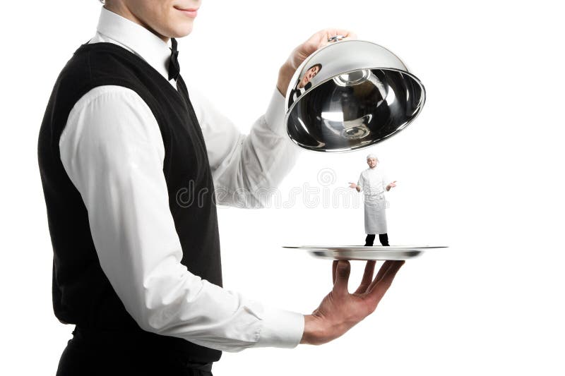 Hands of waiter with cloche