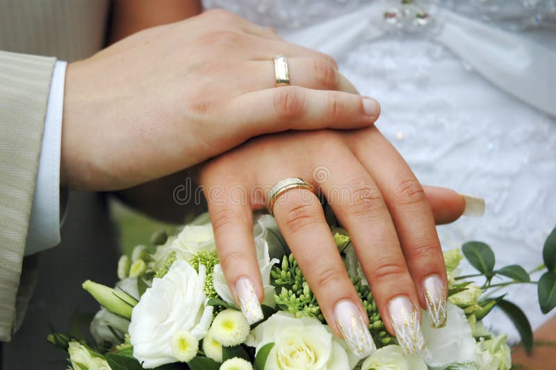 Hands with wedding rings