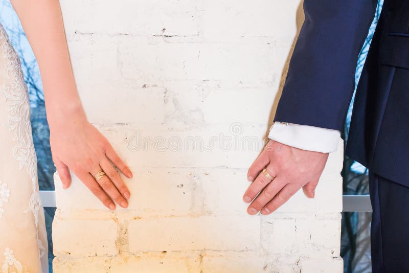 Hands with Wedding Rings that Stretch Towards Each Other Stock Image