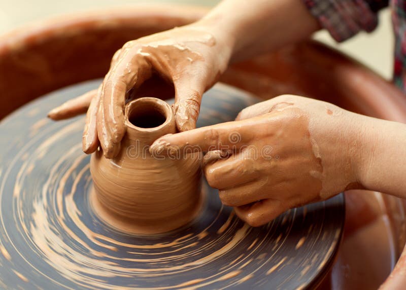 Hands working on pottery wheel. Sculptor, Potter. Human Hands