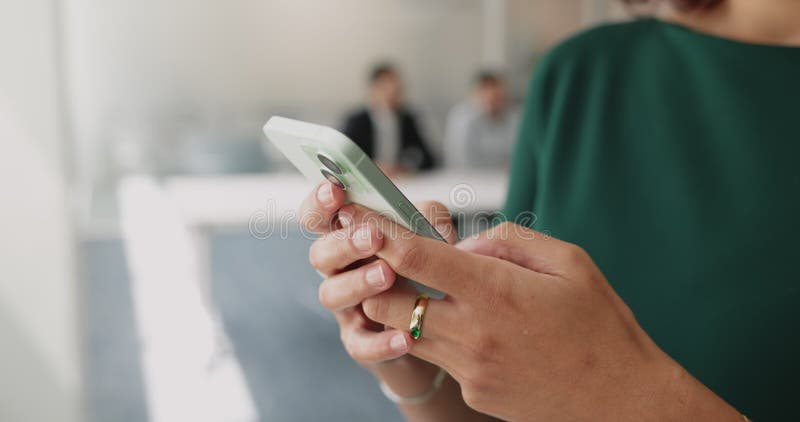 Hands of young businesswoman typing on smartphone stock footage