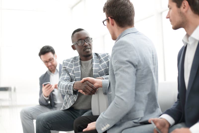 Handshake Manager and client in the office. royalty free stock photo Handshake Manager and client in the office. royalty free stock photo