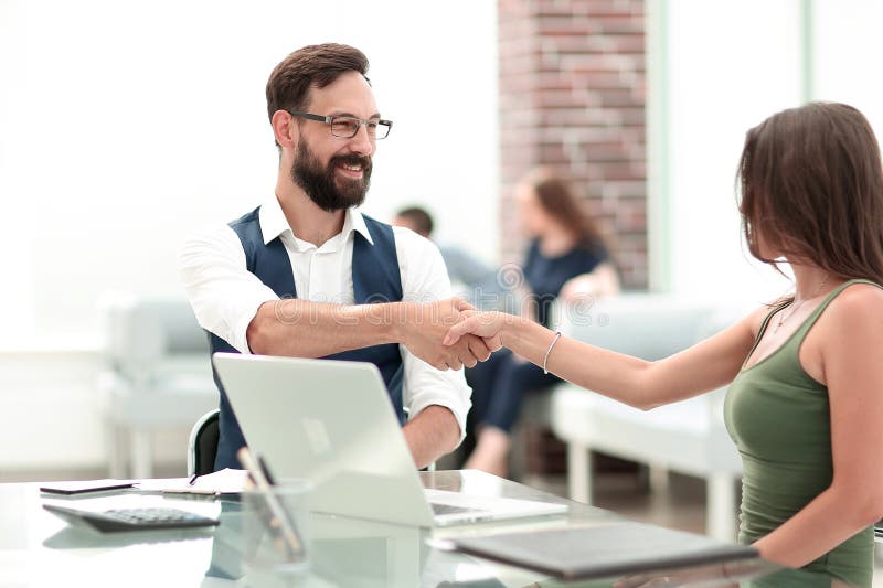 Handshake of a Manager and a Customer at the Desk Stock Photo Image