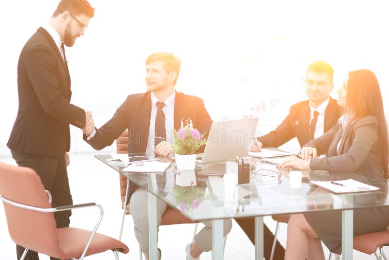 Handshake Manager and employee in the workplace stock photos Handshake Manager and employee in the workplace stock photos