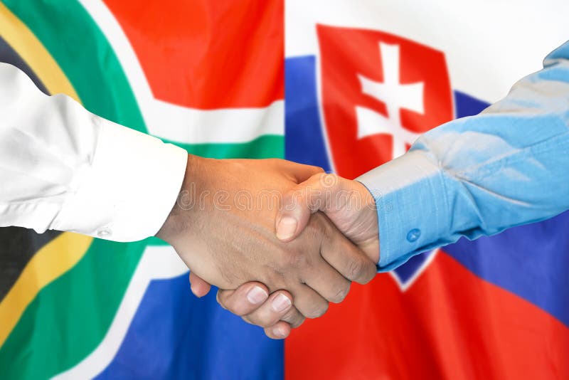 Potřesení rukou na pozadí vlajky jižní Afriky a Slovenska