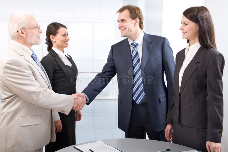 Handshake and teamwork stock images