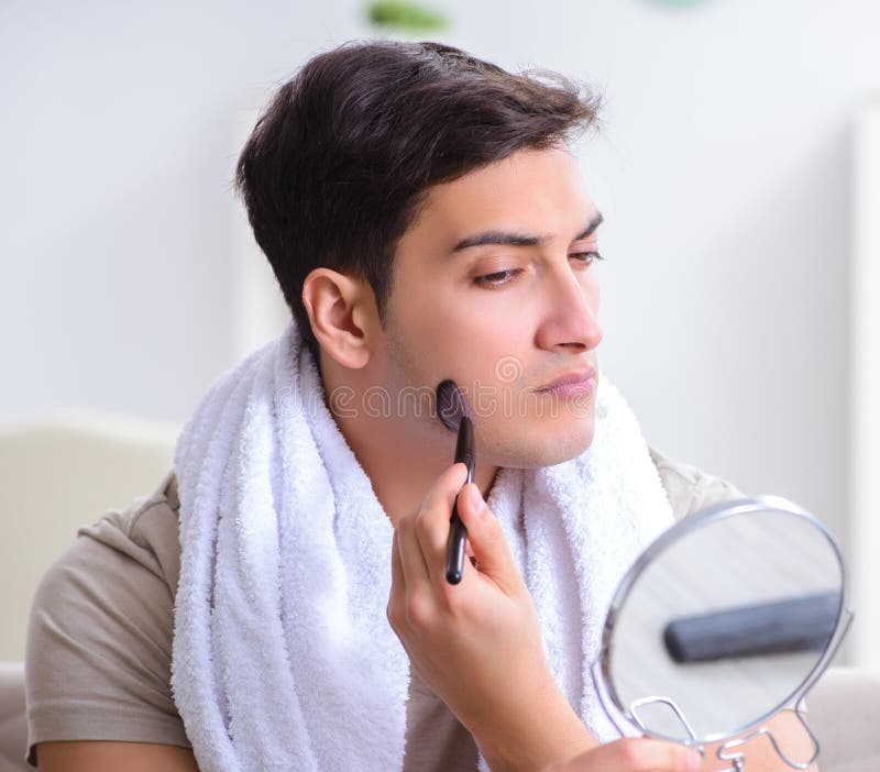 Handsome Applying Clay Mask on Face Stock Photo Image of clay, coal