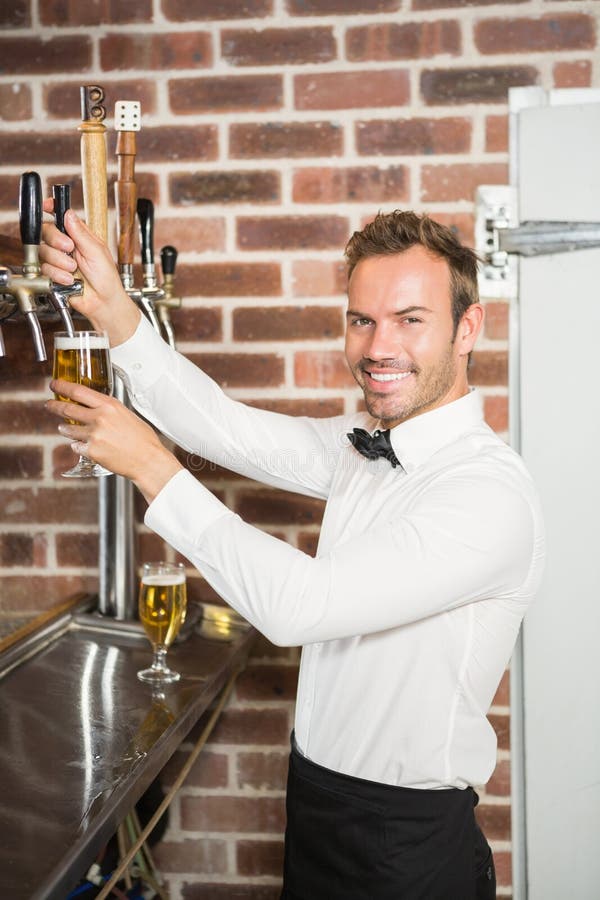 Handsome Bar Tender Pouring a Pint Stock Photo Image of beer
