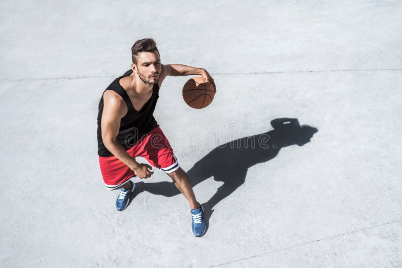 Handsome Basketball Player Training on Court Alone Stock Photo Image