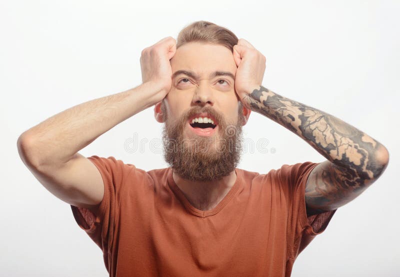 Handsome bearded man with headache royalty free stock photography Handsome bearded man with headache royalty free stock photography