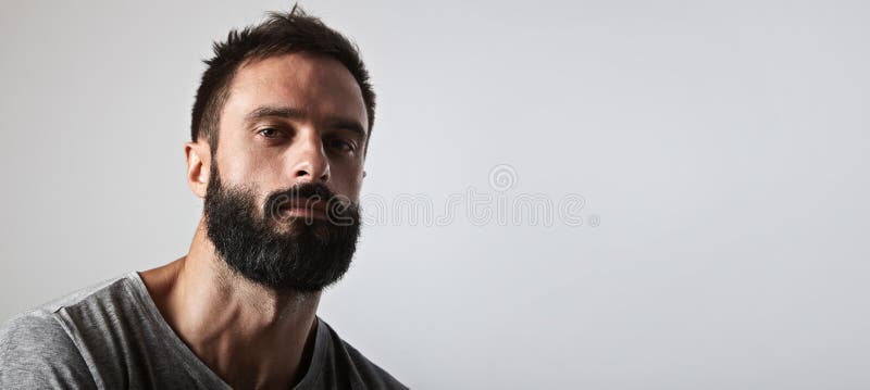 Handsome bearded man looking at camera royalty free stock photo Handsome bearded man looking at camera royalty free stock photo