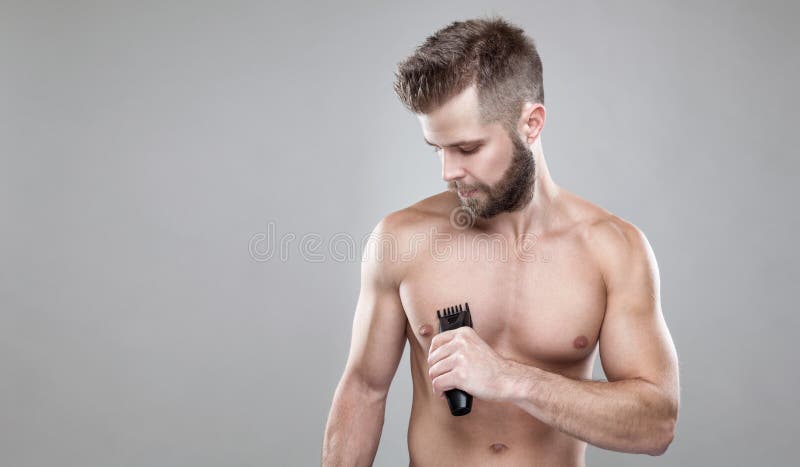 Handsome Bearded Man with a Trimmer Shaving Off Body Hair Stock Photo - Image of beauty, electric: 101019390 Handsome Bearded Man with a Trimmer Shaving Off Body Hair Stock Photo - Image of beauty, electric: 101019390