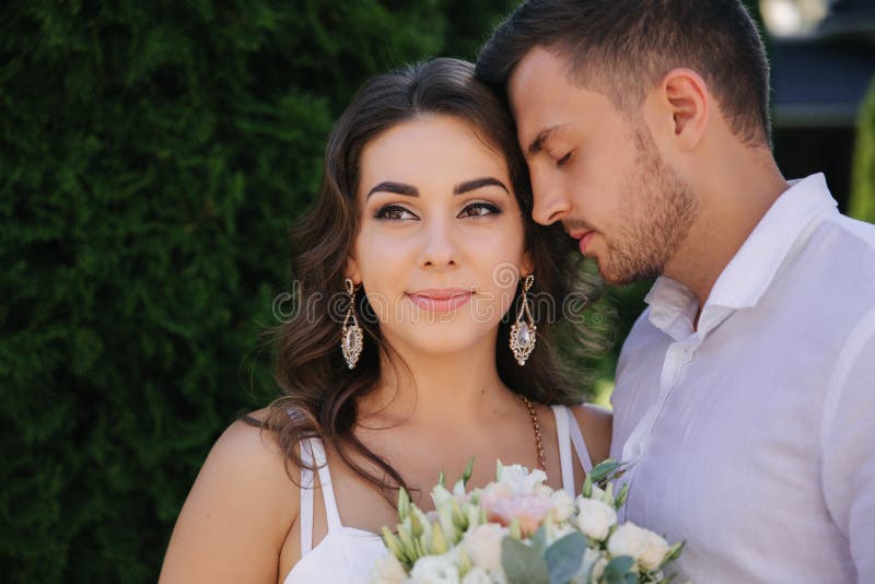 Handsome Man Kiss Her Lovely Wife. Beautiful Woman in White Dress Hug ...