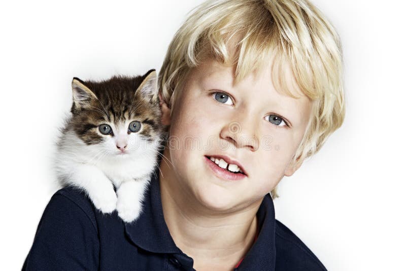 Handsome boy with kitten on shoulder