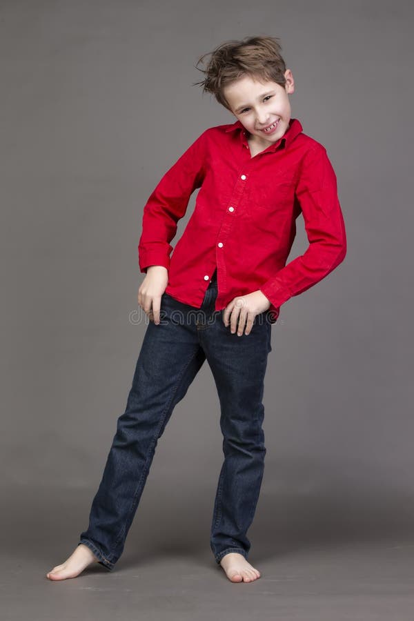 Handsome Boy in a Red Shirt and Jeans on a Gray Background Stock Photo -  Image of casual, nine: 211214044