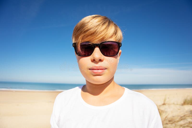 Handsome Boy in Sunglasses Close Portrait on Beach Stock Photo Image