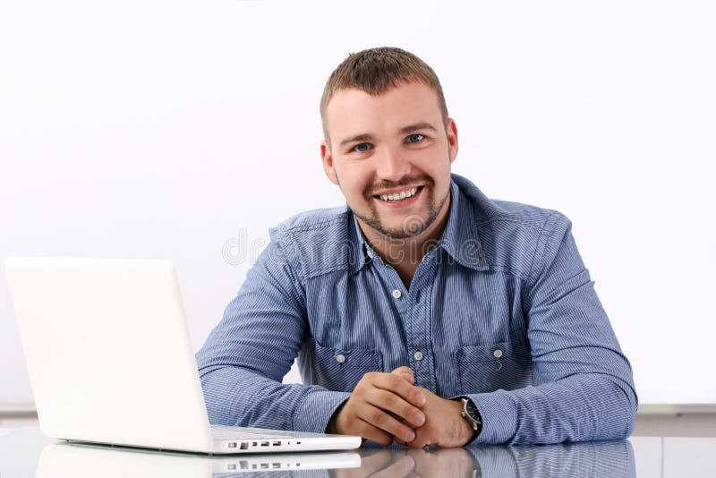 Handsome businessman at his workplace